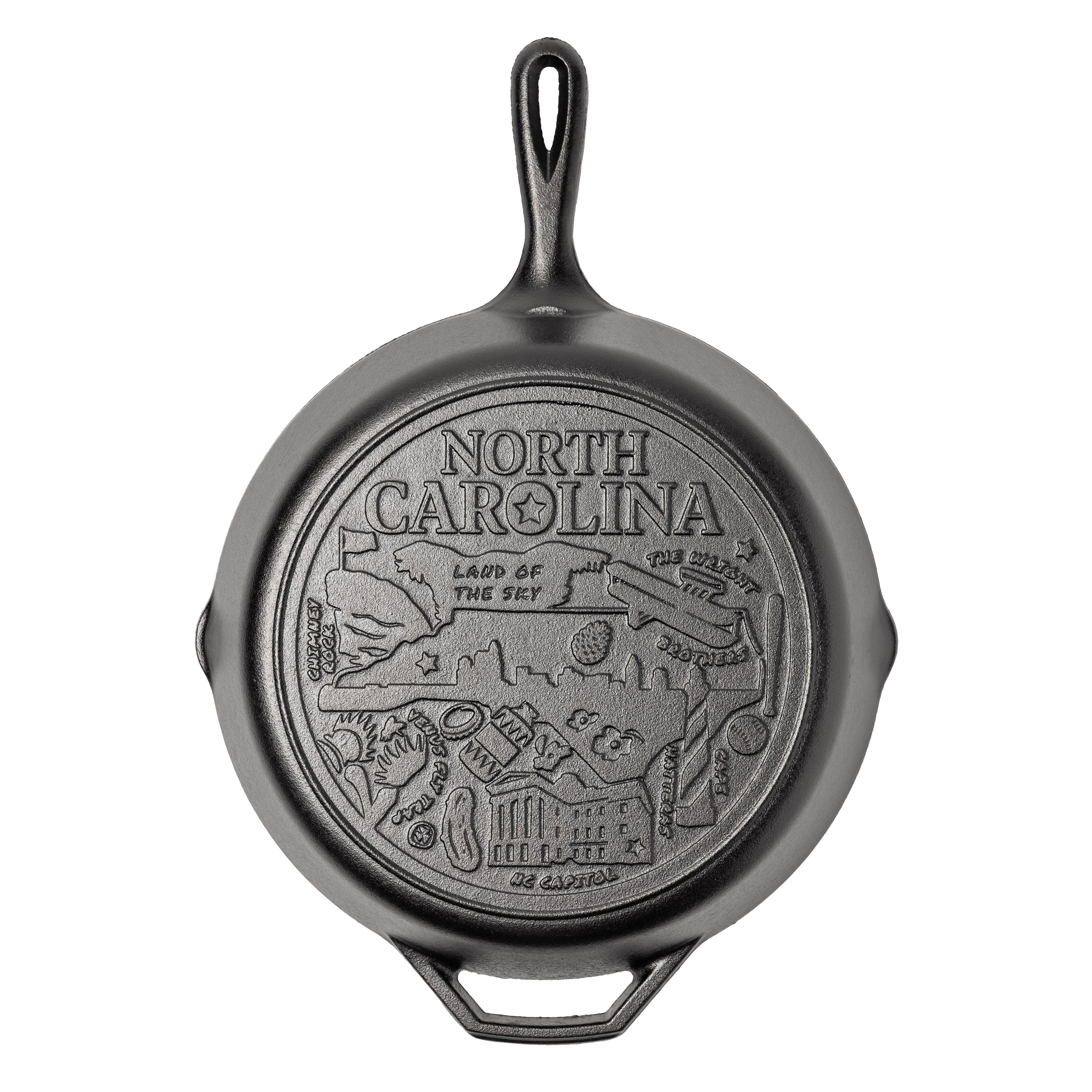 Cast iron skillet with the bottom engraved with beloved icons and monuments from North Carolina.