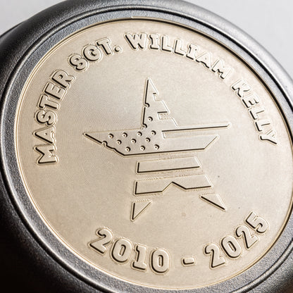 Close-up of a commemorative skillet with engraved text and design