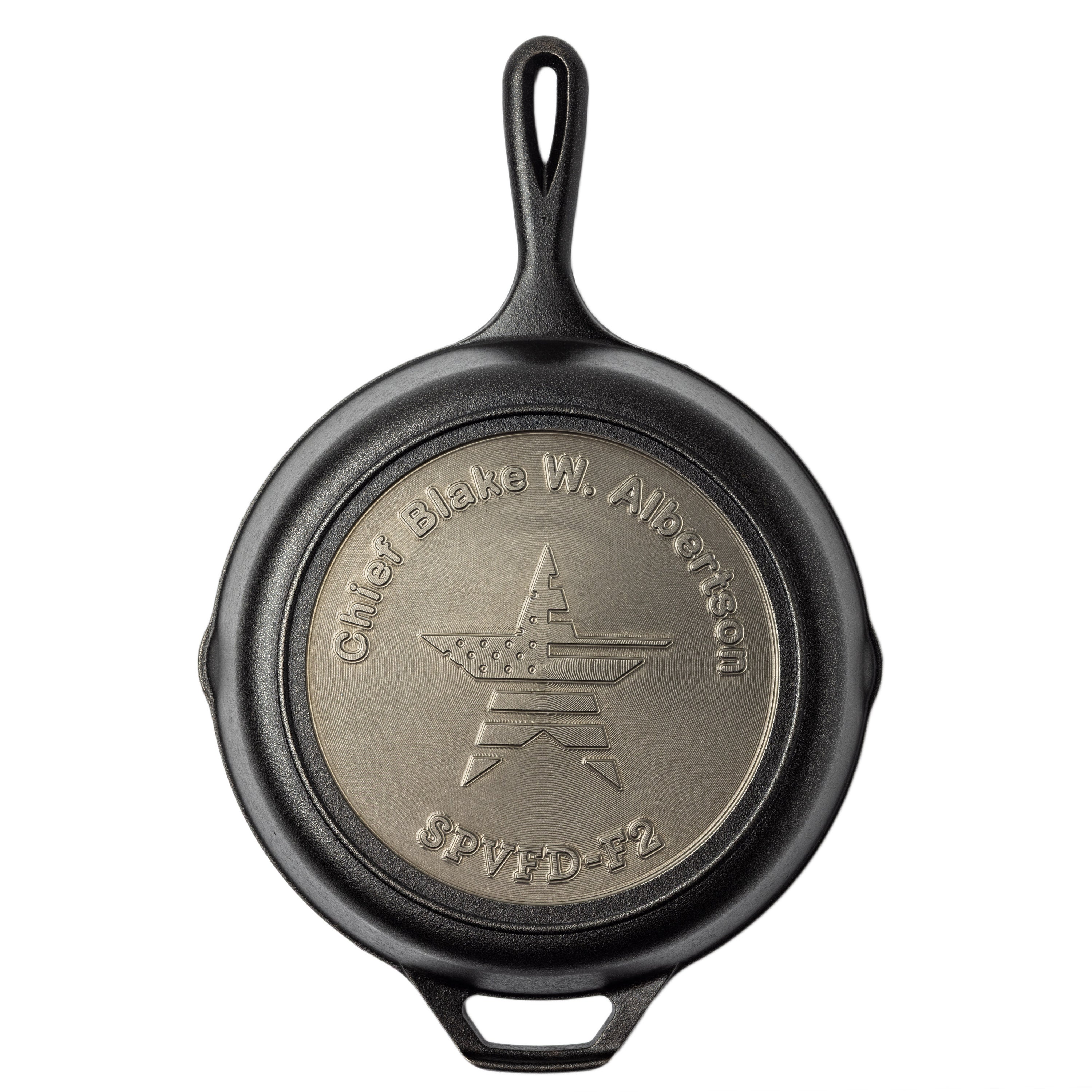 Personalized skillet displaying veterans name and rank.