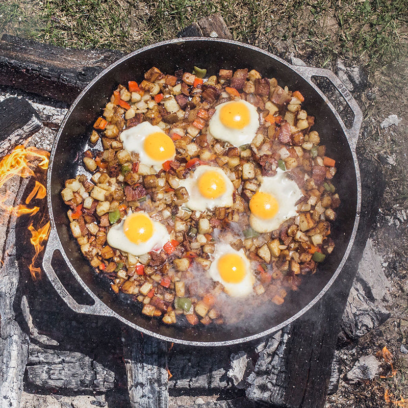 Hashbrown's and eggs cooking over  campfire.