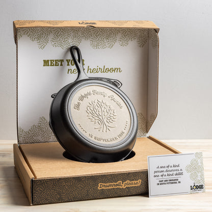 Cast iron skillet in a decorative box with branding and text