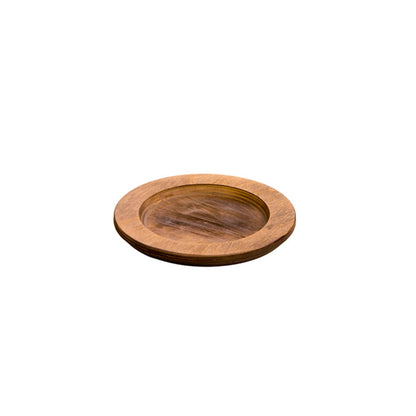 A circular wooden underliner with indent for skillet or other serving dish.