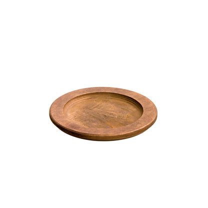 A circular wooden underliner with indent for skillet or other serving dish.