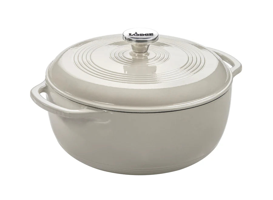 Oyster white enameled cast iron Dutch oven with lid on a white background