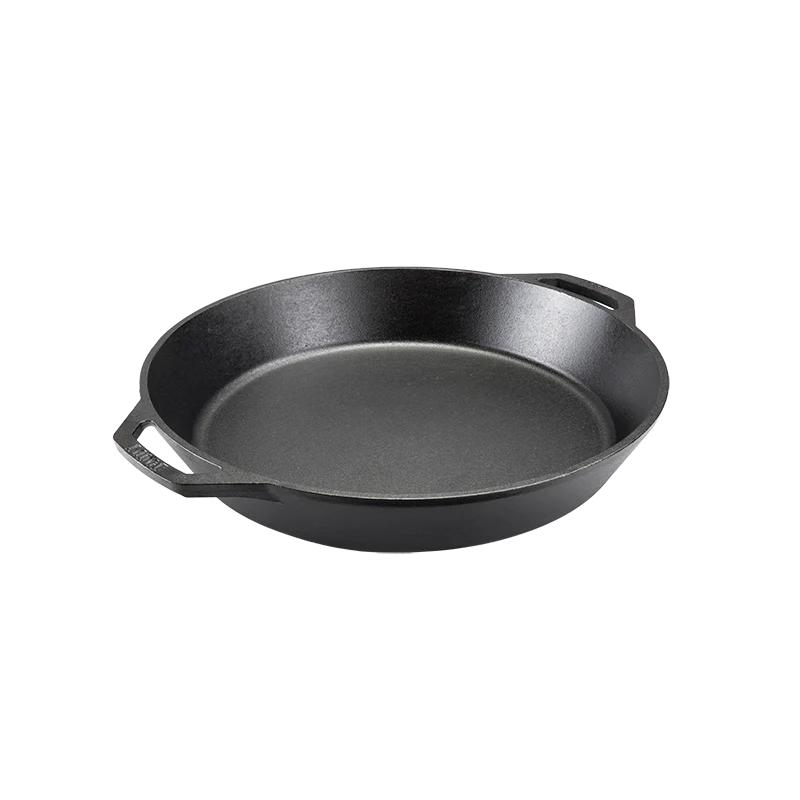 Black cast iron skillet with two loop handles.
