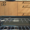 Someone placing dutch oven in oven to prepare fresh stew.