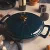 Close-up view of braiser sunburst design.