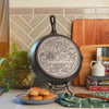 Close-up view of the monuments and icons that fill the bottom of the skillet.