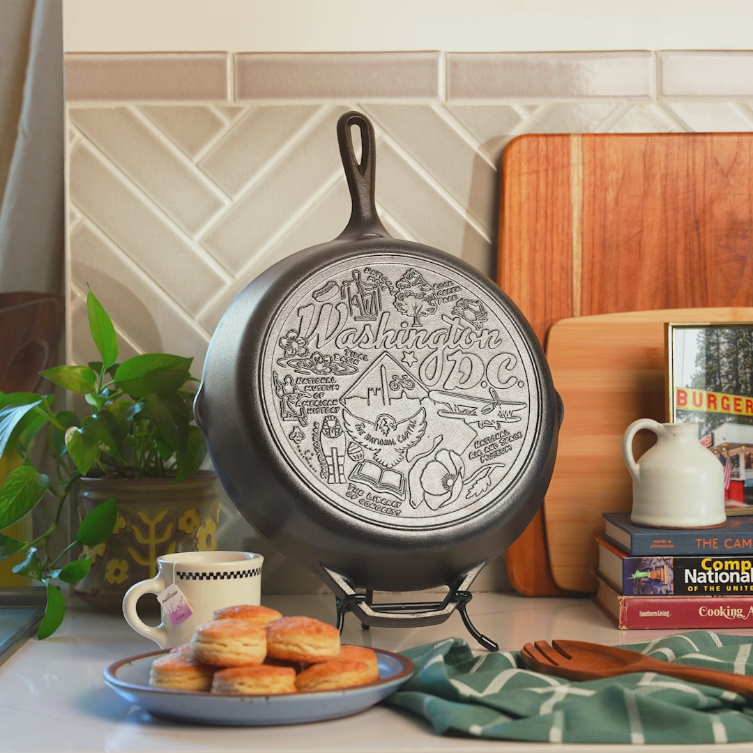 Close up view of engraved design on bottom of skillet.