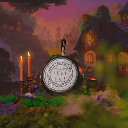 Skillet displayed with fantasy background alongside burning candles and rolling smoke.