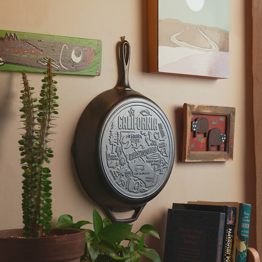 View of state skillet displayed on a wall with other decorations.