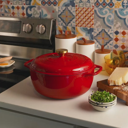Someone removing lid on dutch oven revealing freshly made pasta salad.