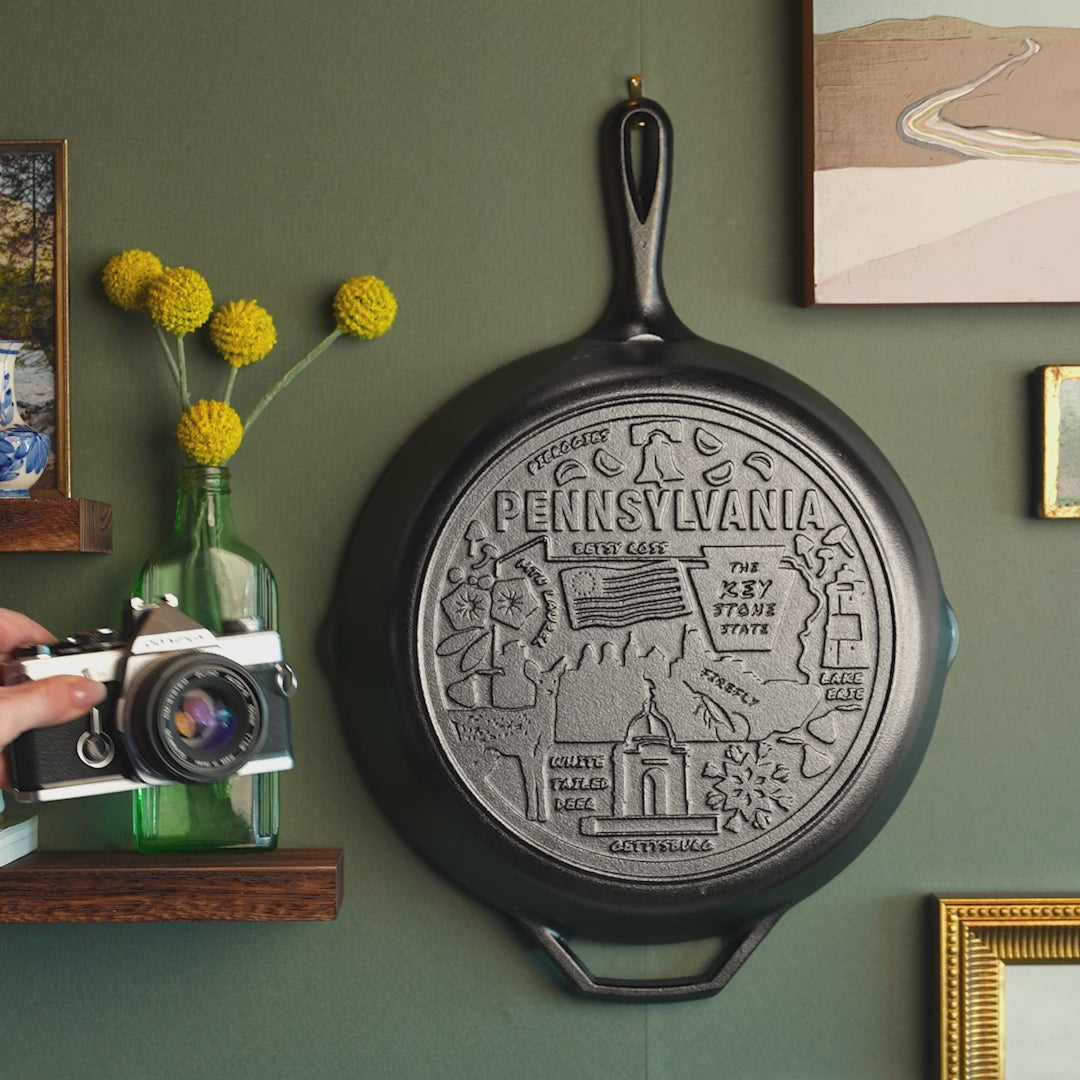 Close up view of engravings on bottom of the skillet.