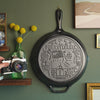 Close up view of engravings on bottom of the skillet.