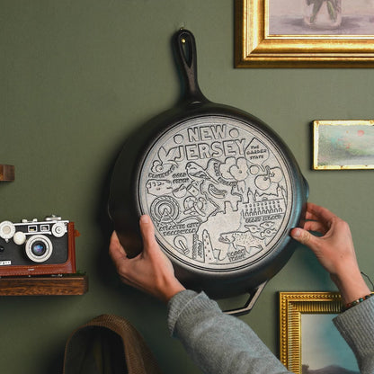 Close up view of engraved design on bottom of skillet.