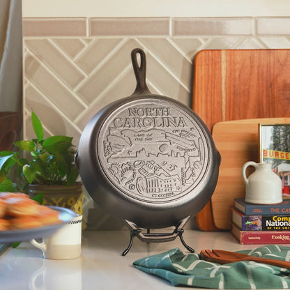 Close up view of the engraved icons on bottom of skillet.