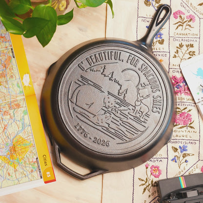 Close-up view of engraved design on back of skillet.