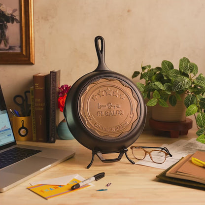 Custom skillet sample displayed on desk as a sales reward.